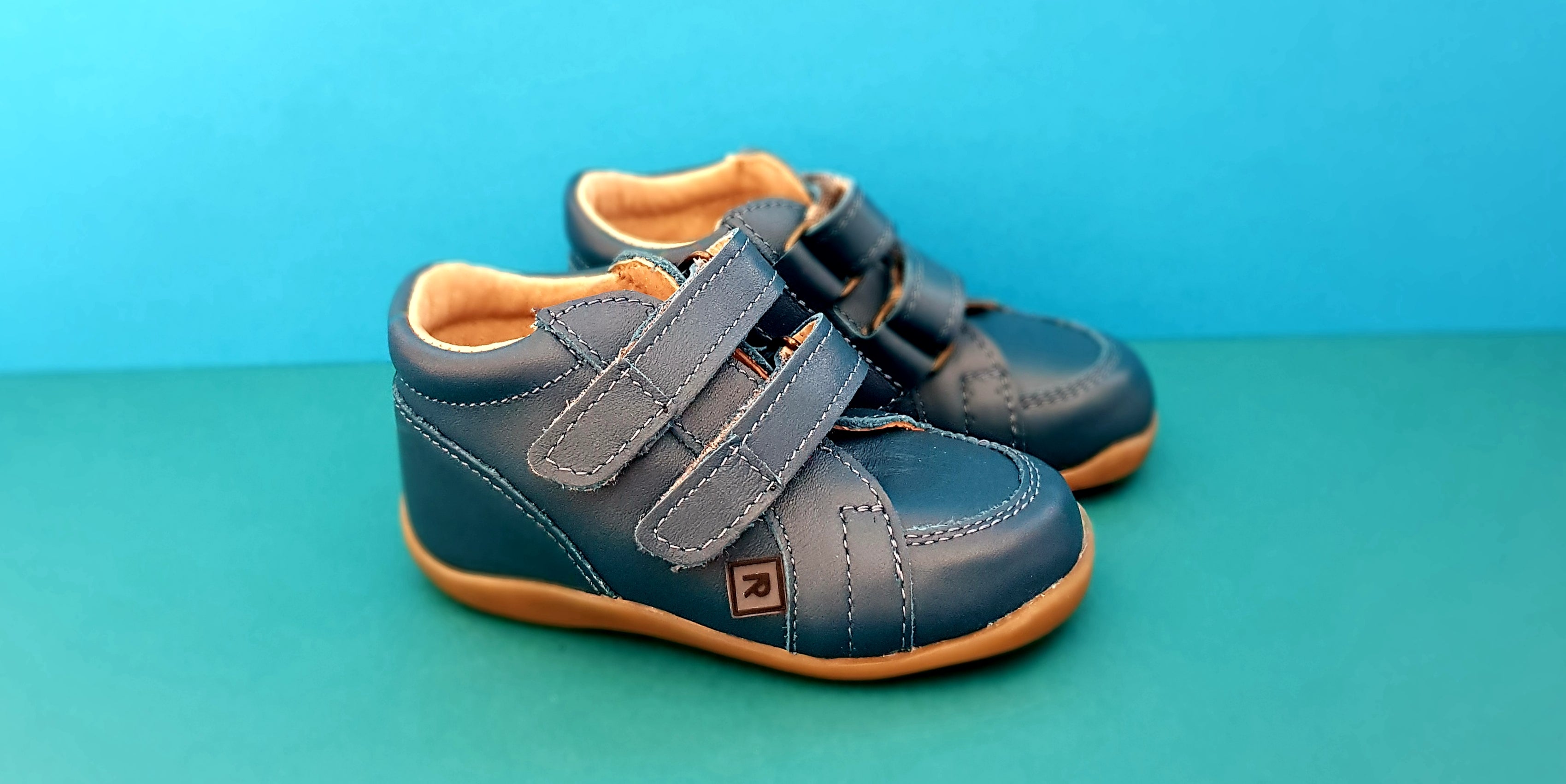 Dark Blue First Walking Shoes for Toddlers made from soft leather with hood-and-loop fastener
