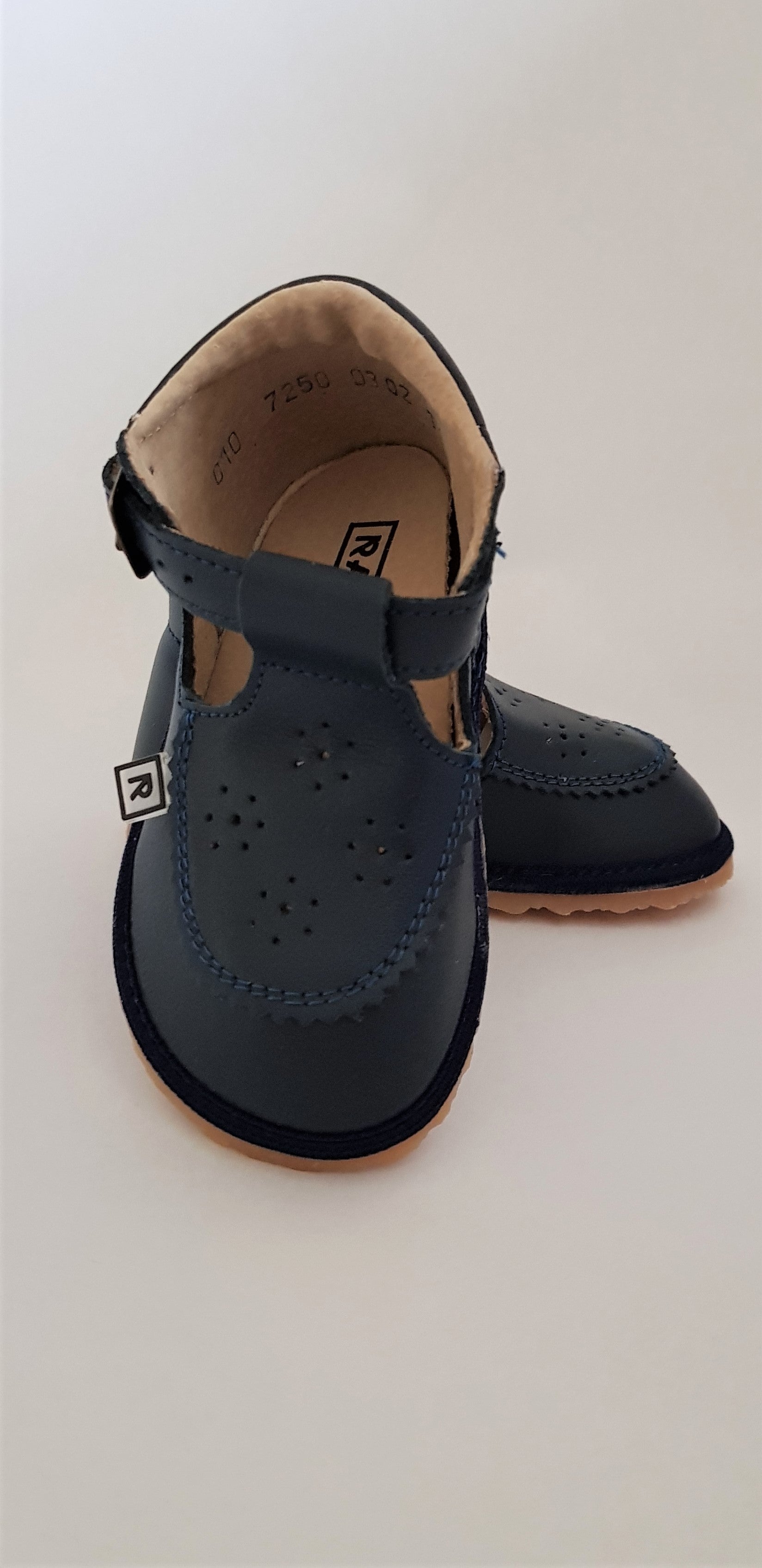 Navy first walking t-bar shoes for babies or toddlers with anatomically shaped toe box made from soft leather